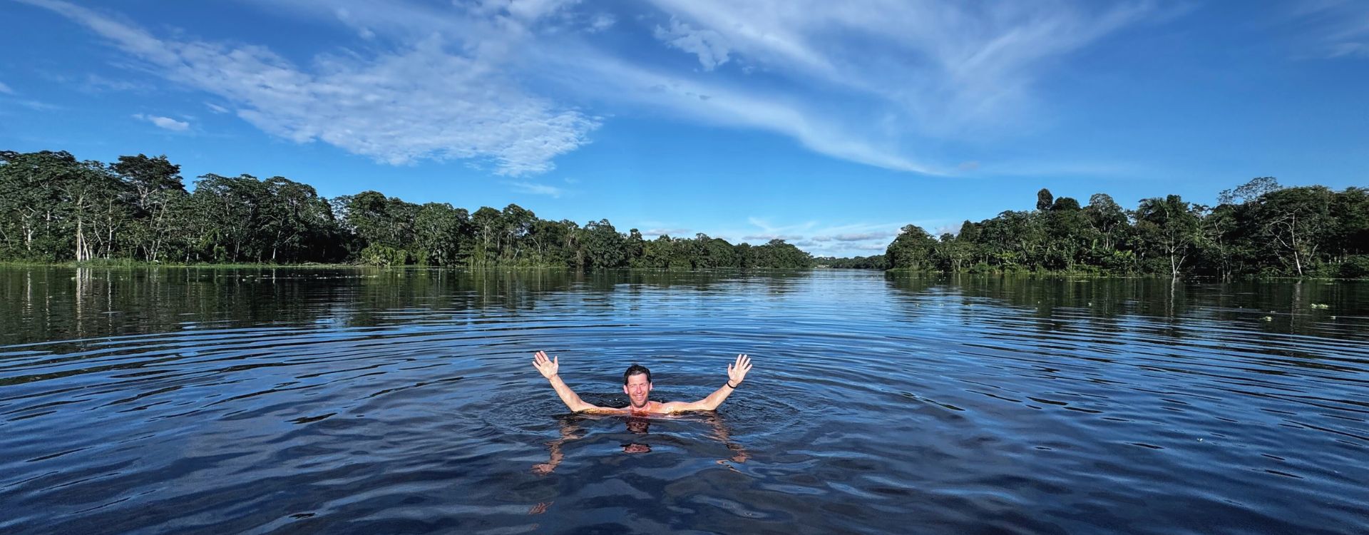 Man swimming in the Amazon River in Peru
