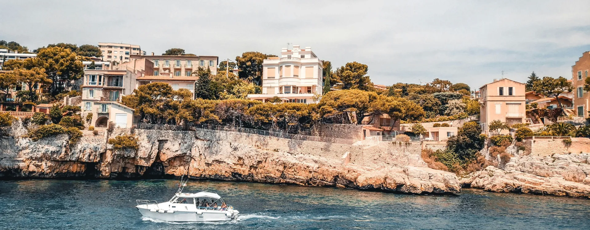 A boat cruising along the French Riviera