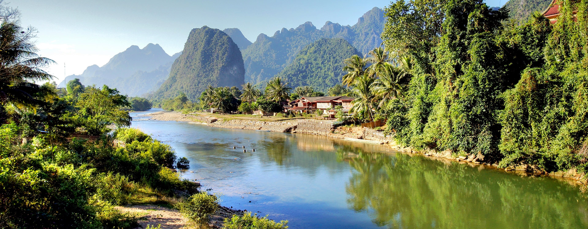 Surreal landscape by the Song river at Vang Vieng, luxury holidays to Laos