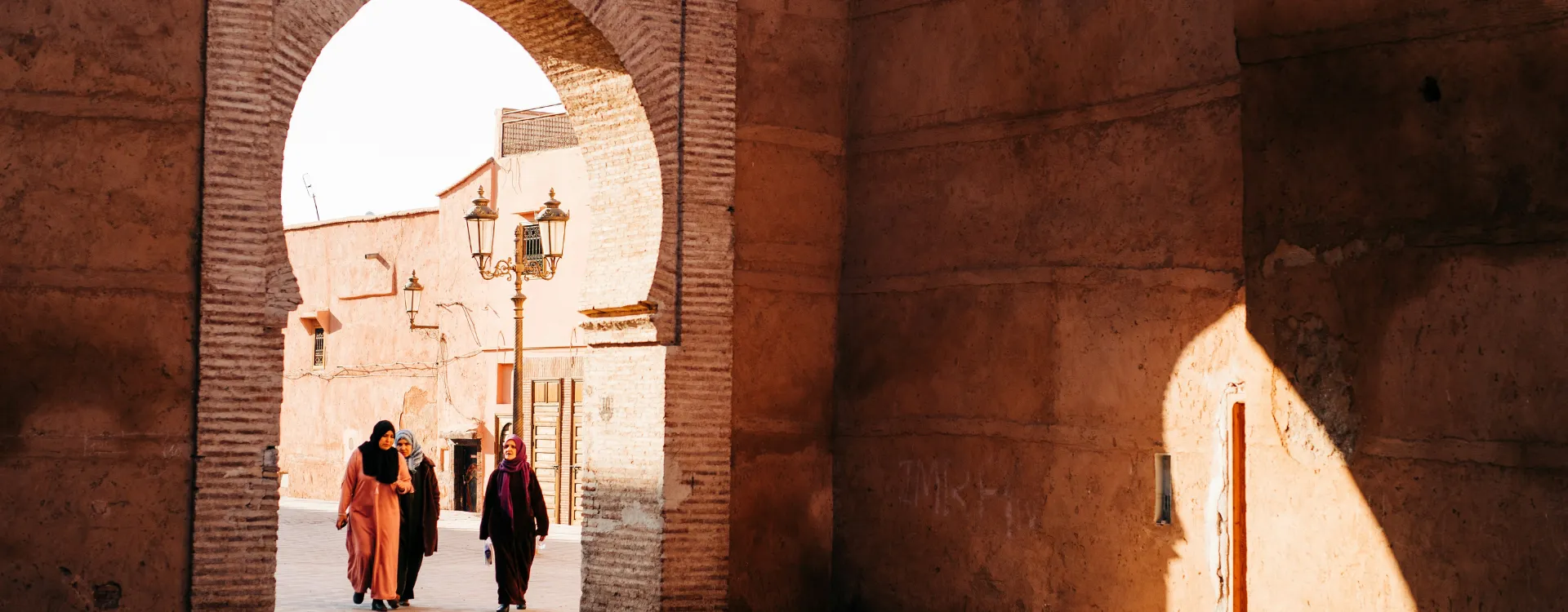 A group of women walking through the madina in Fez