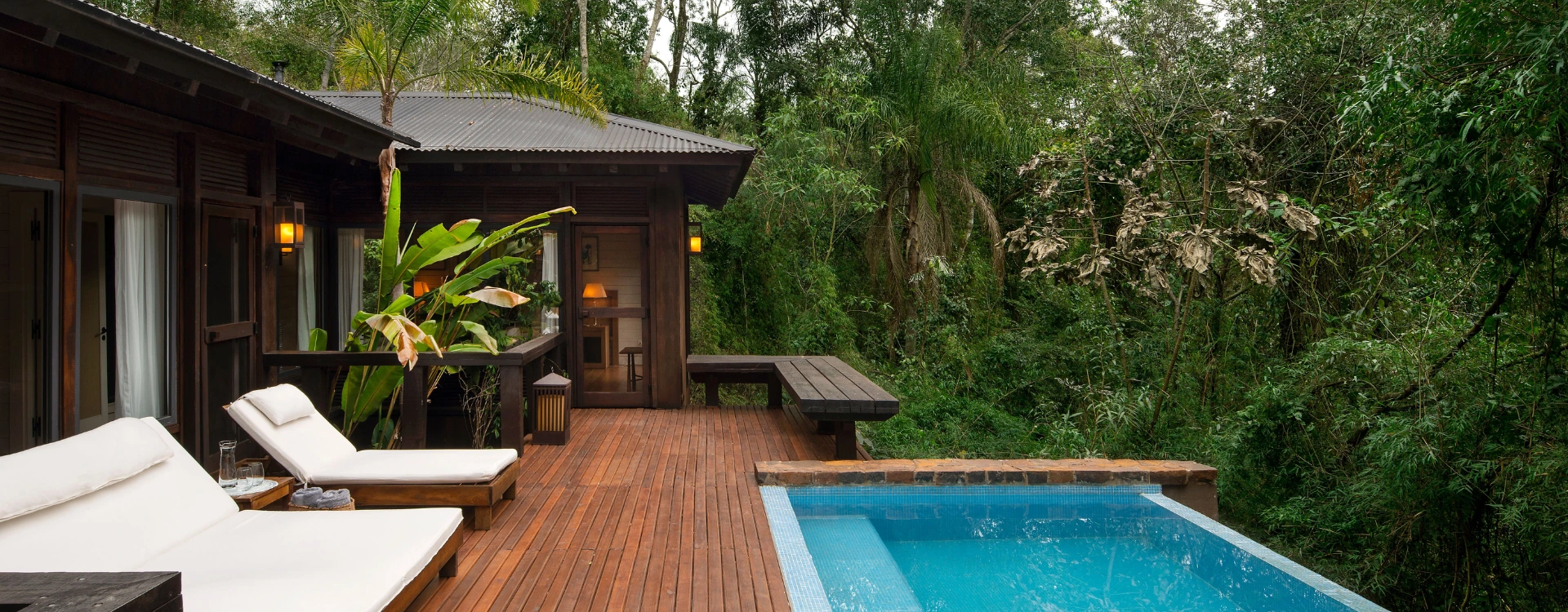 Private hotel villa with an outdoor terrace and pool in the rainforest